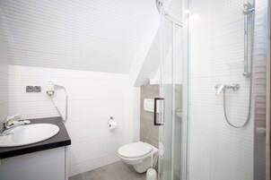 Bathtub, hair dryer, towels, soap