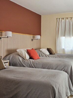 Standard Triple Room | Premium bedding, down duvets, in-room safe, individually decorated - Hotel Lunajuim (El Chalten)