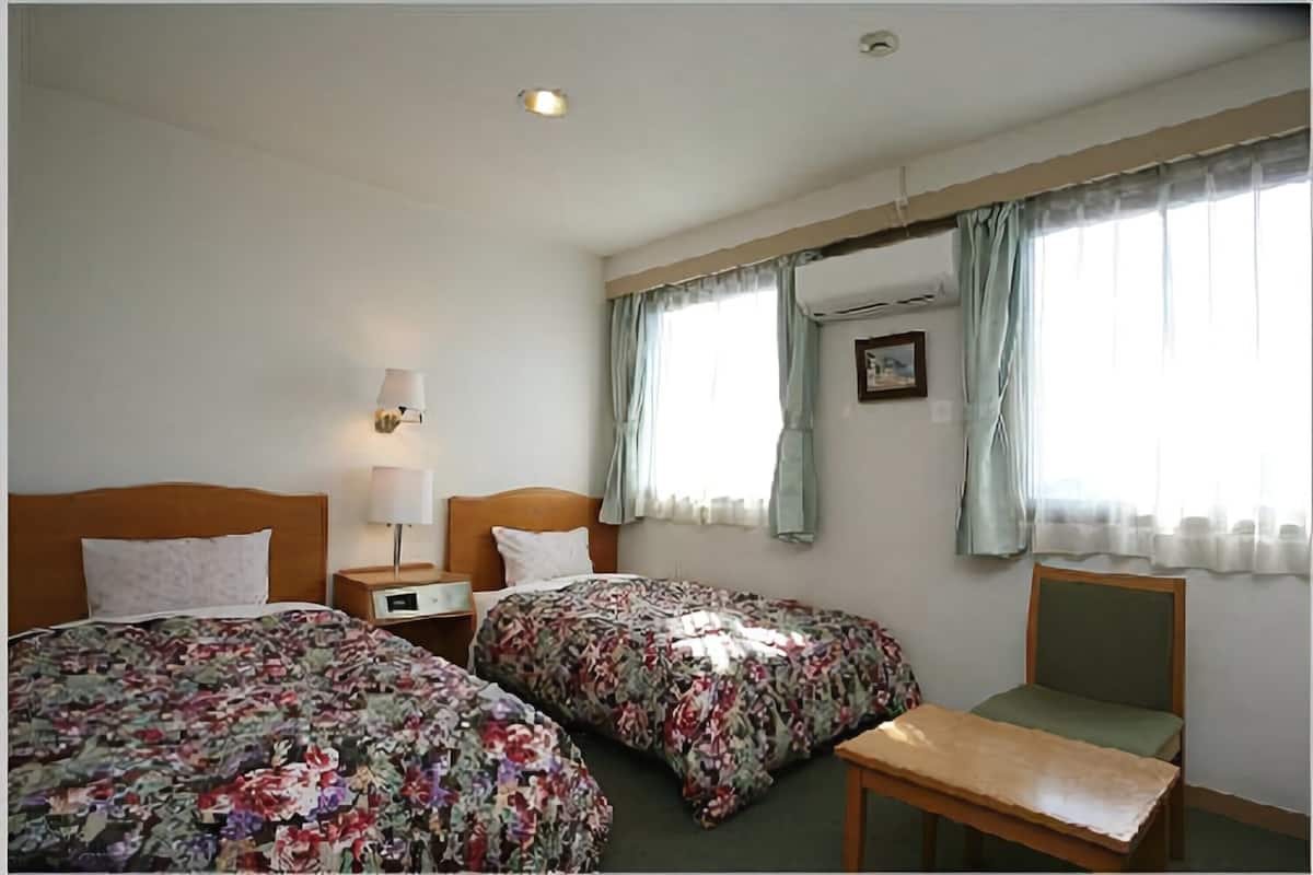 Habitación con 2 camas individuales | Wifi gratis y ropa de cama