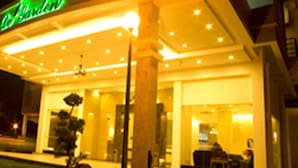 A hotel entrance with a well-lit facade, a visible reception desk, and a clear view of the interior through the glass doors. - De Garden Hotel (Butterworth)