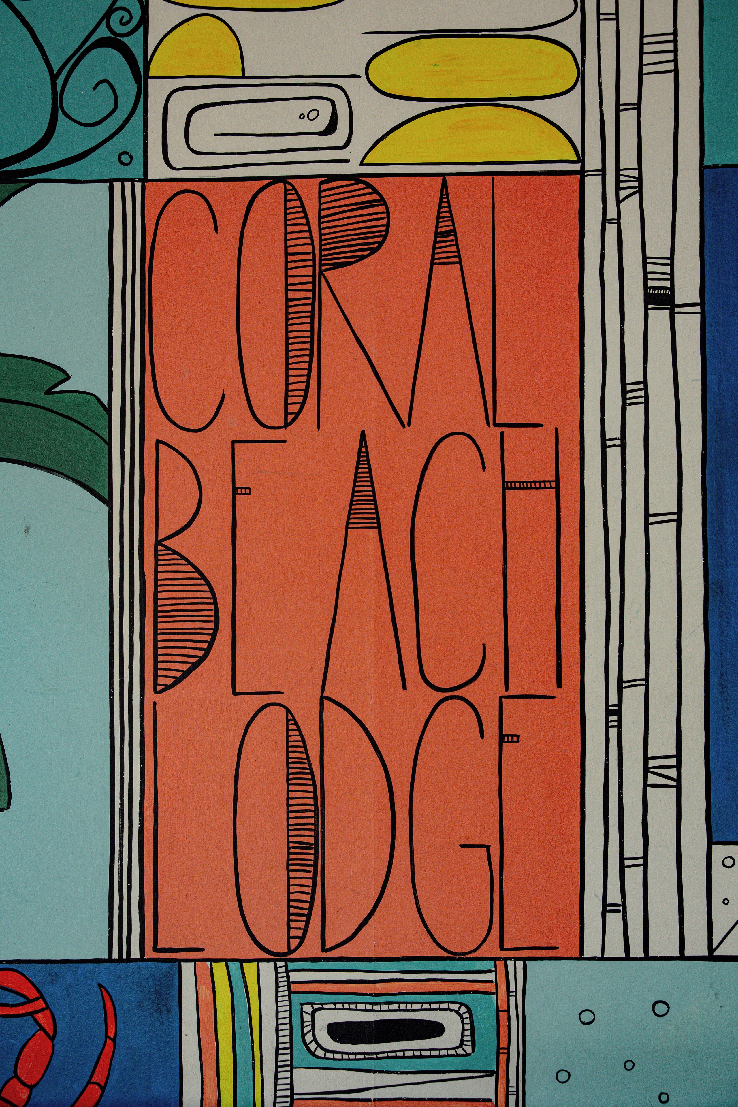 A colorful abstract design with the text "CORAL BEACH ODG" prominently displayed.