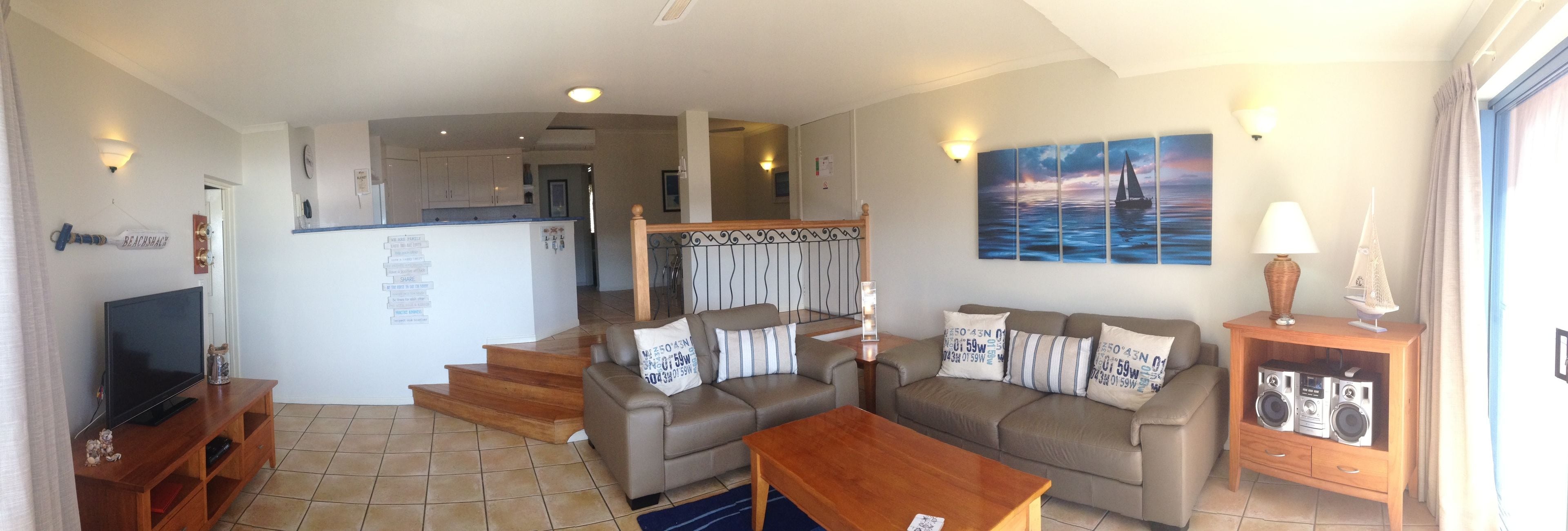 three bedroom ocean view apartment with rooftop hot tub | living area | 55-inch lcd tv with digital channels, tv, dvd player