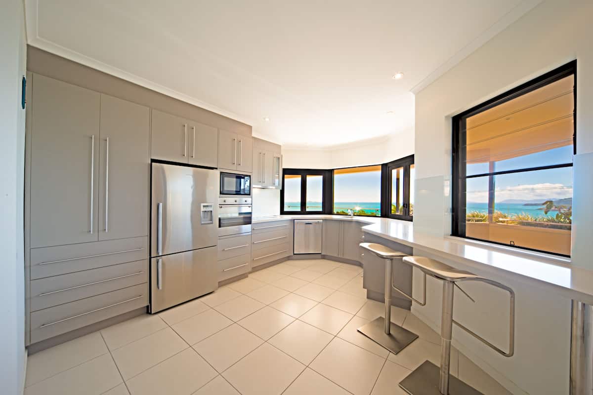 three bedroom ocean view penthouse | private kitchen | full-sized fridge, microwave, oven, stovetop