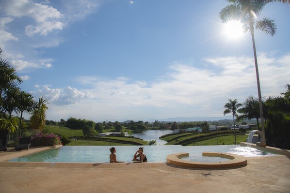 Outdoor pool, open 9:00 AM to midnight, pool loungers