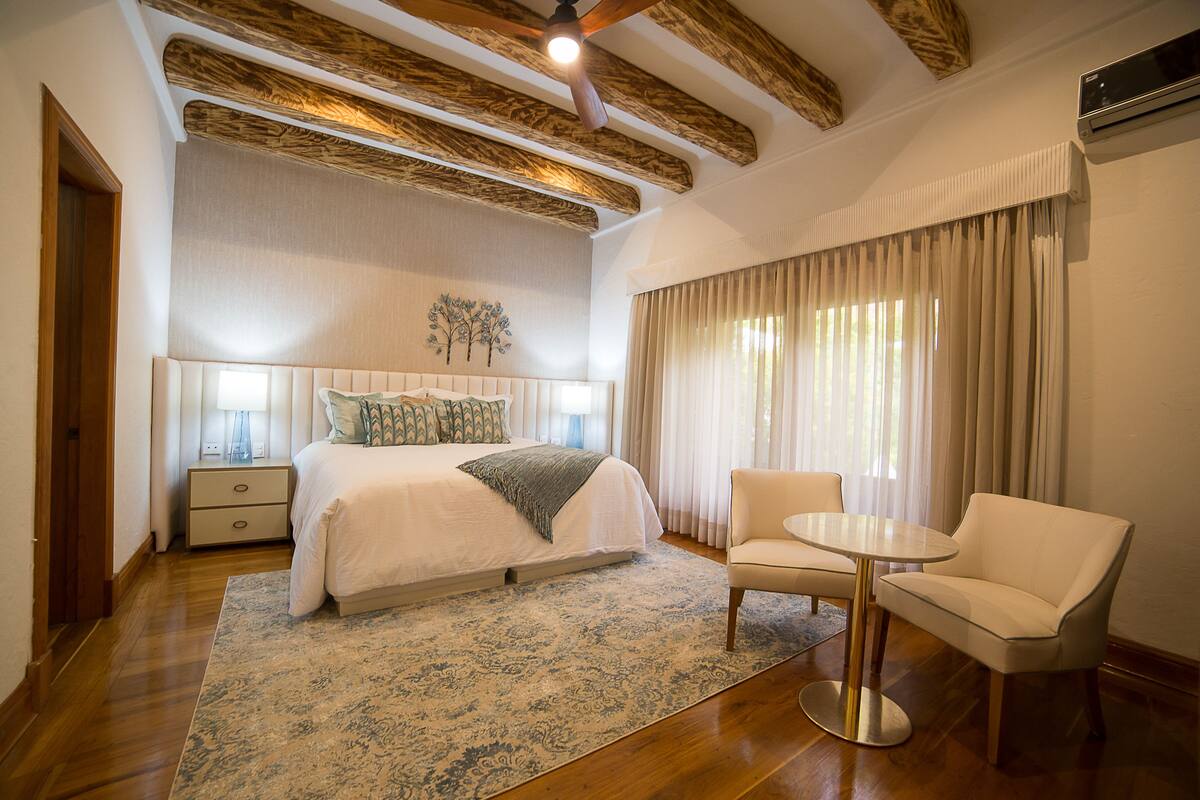 junior suite, lake view | premium bedding, minibar, in-room safe, desk