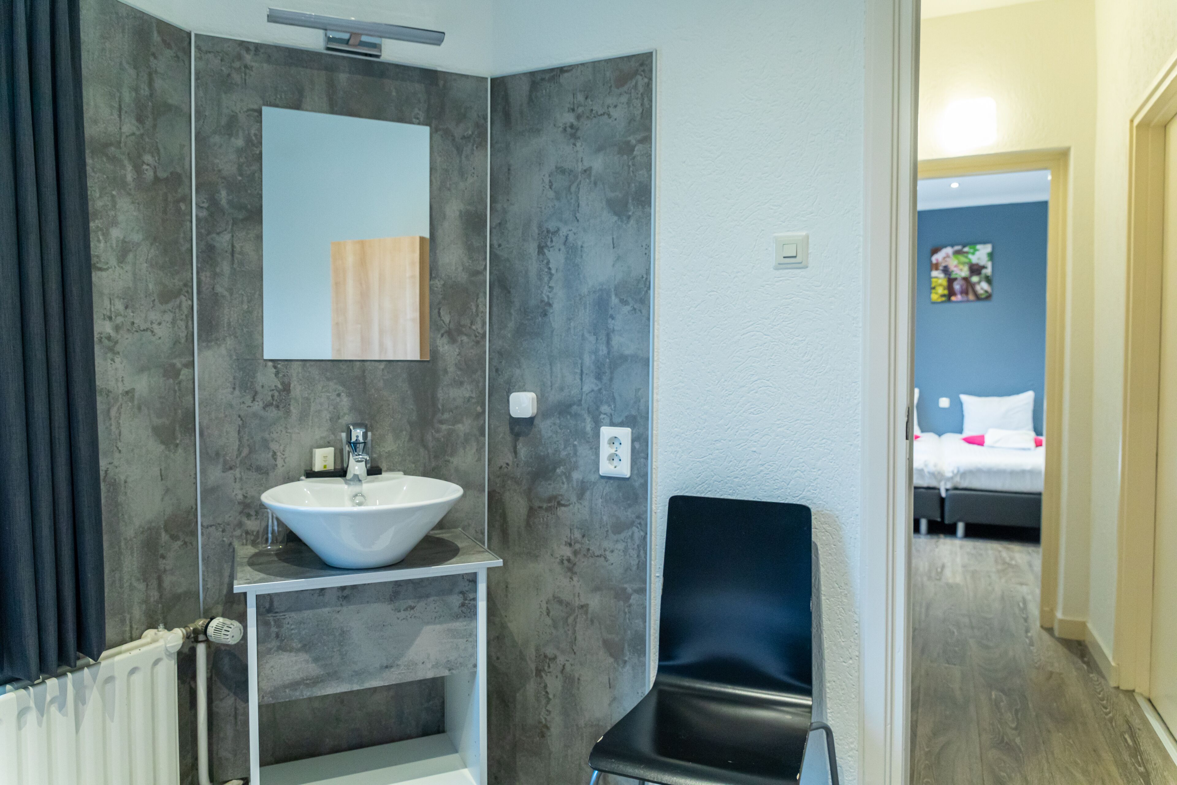 standard triple room | in-room safe, desk, laptop workspace, blackout curtains