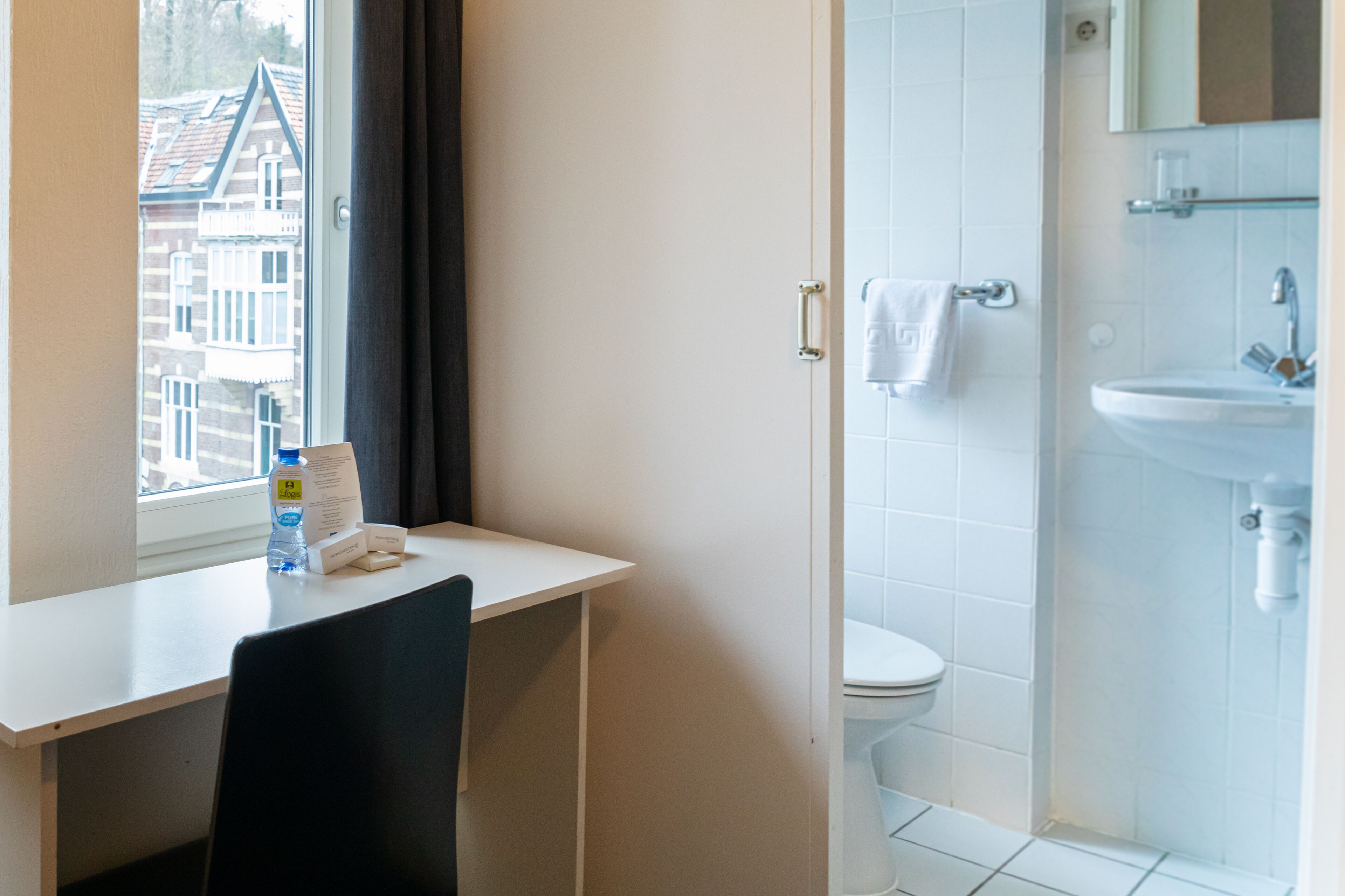 standard single room | in-room safe, desk, laptop workspace, blackout curtains