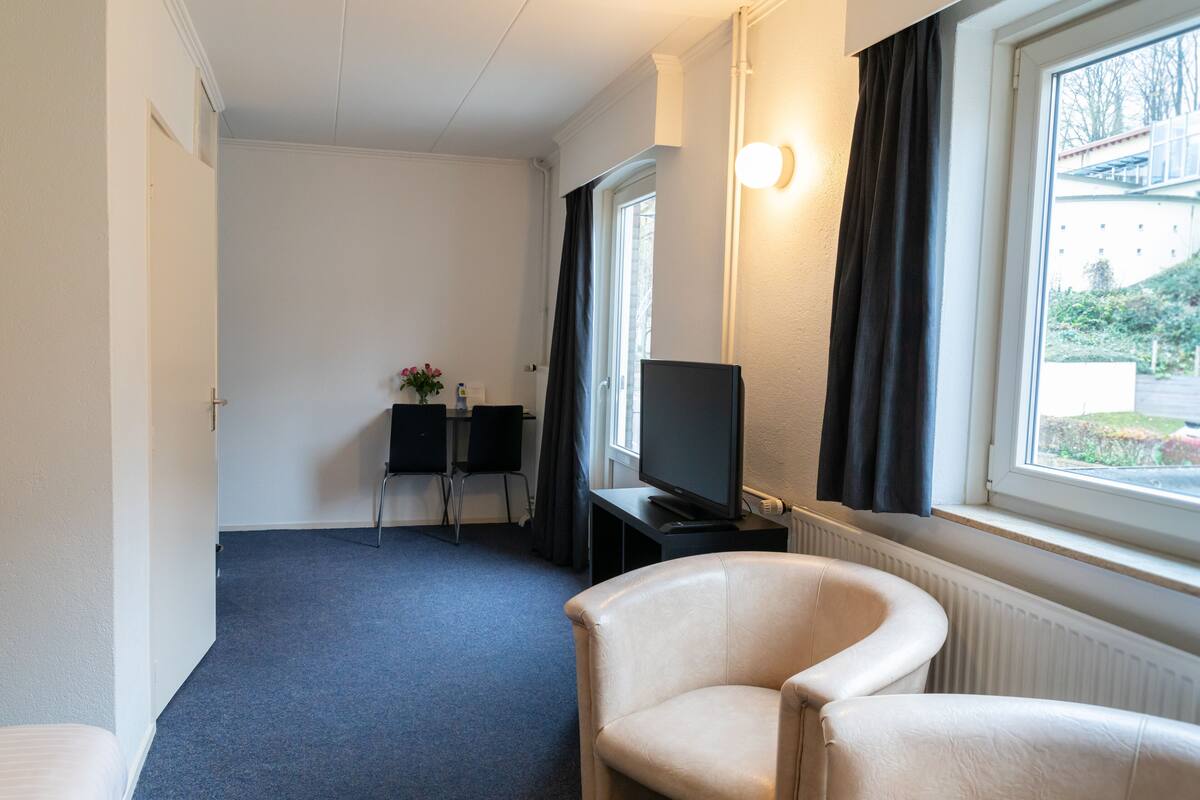 standard double room | in-room safe, desk, laptop workspace, blackout curtains