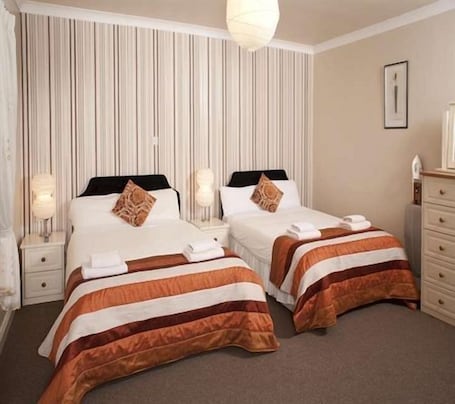 Premium bedding, desk, iron/ironing board, rollaway beds