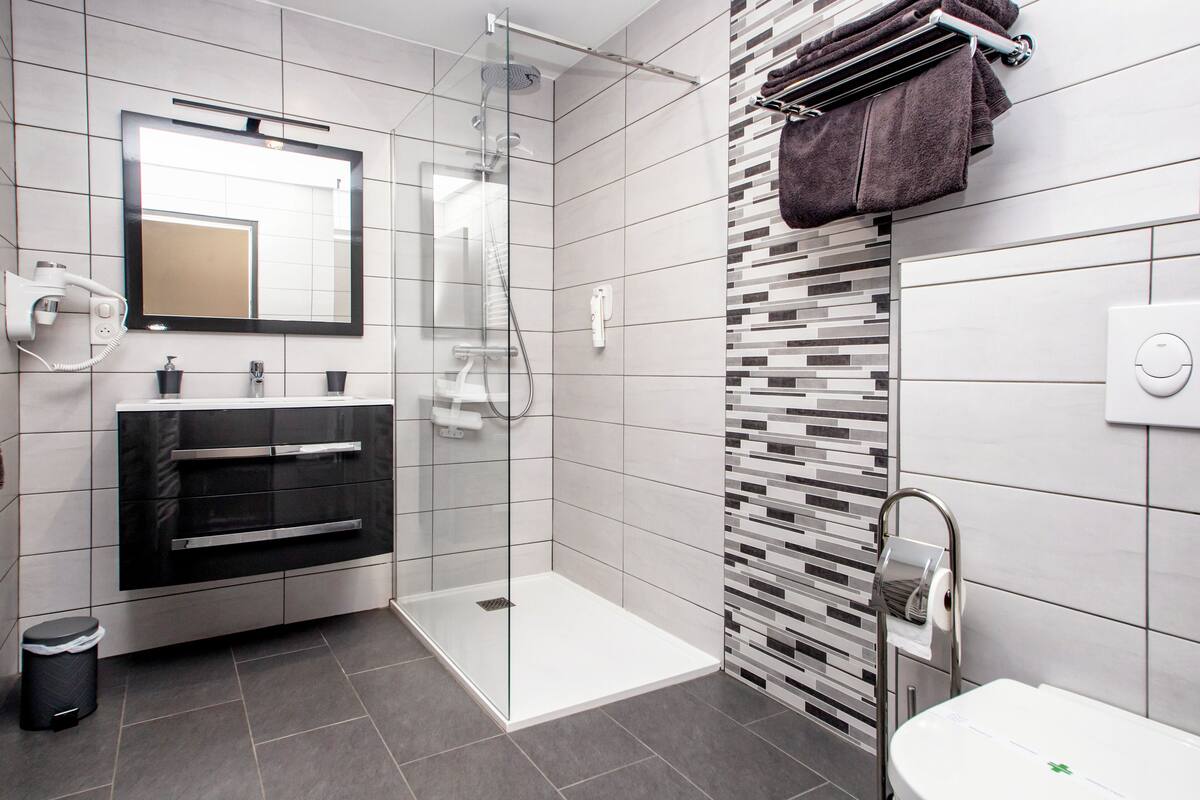 superior double room | bathroom | hair dryer, towels