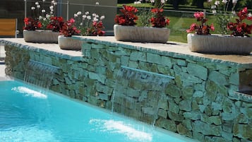 Seasonal outdoor pool, open 8:00 AM to 9:00 PM, pool umbrellas