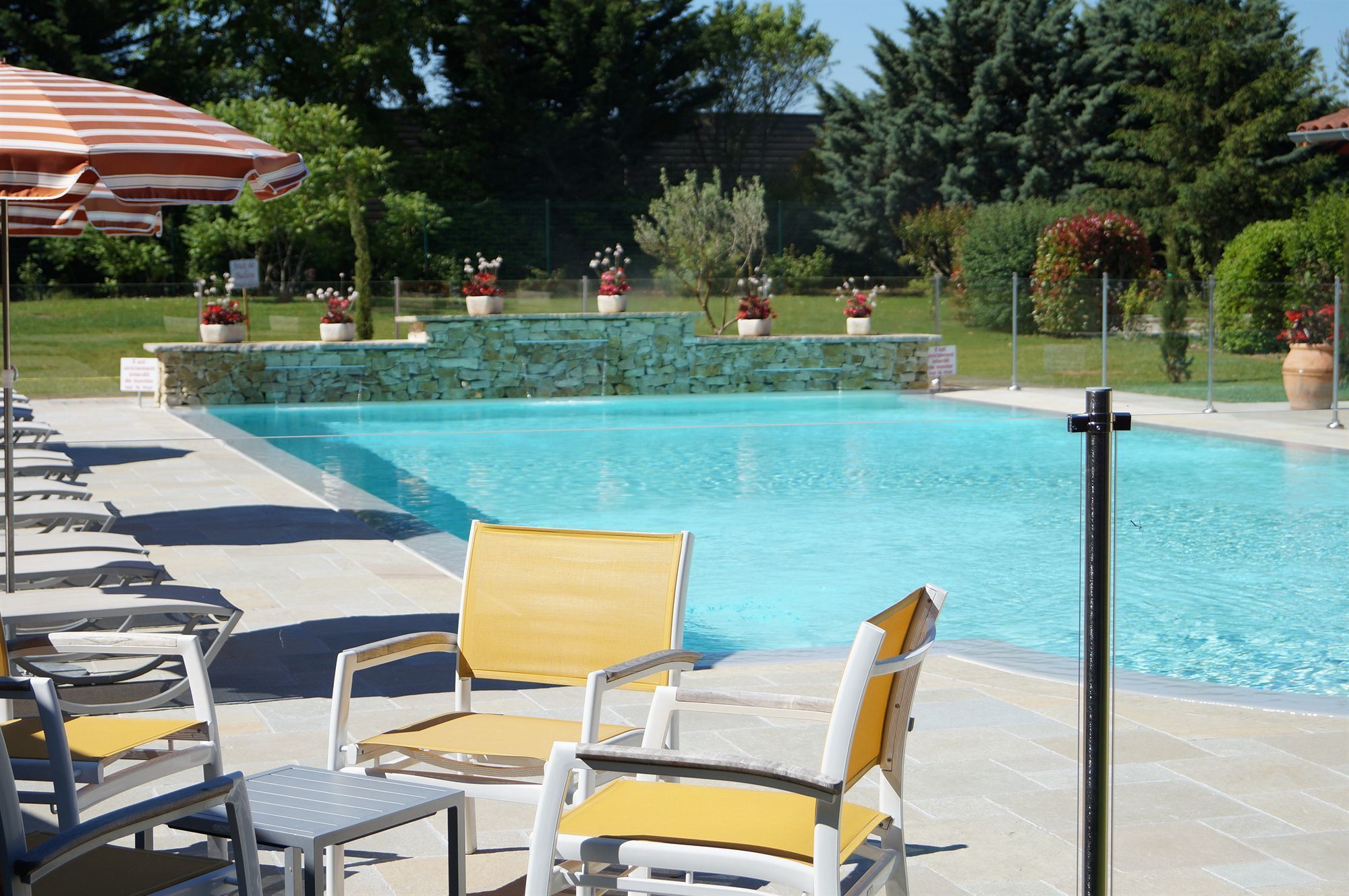 seasonal outdoor pool, open 8:00 am to 9:00 pm, pool umbrellas