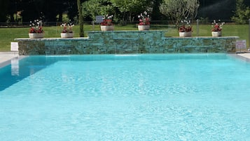 Surrounded by lush greenery, this pool offers a serene escape.