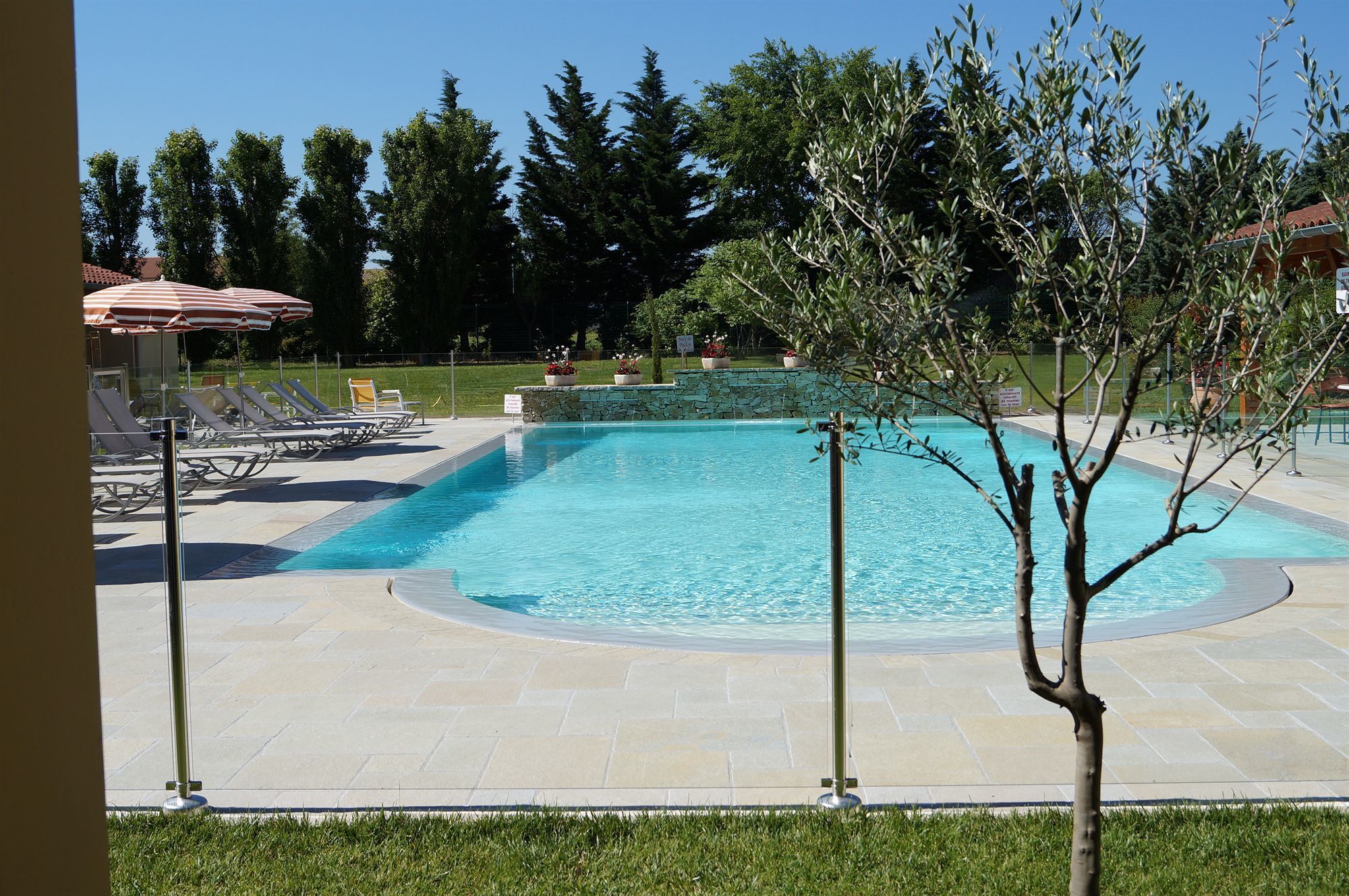 seasonal outdoor pool, open 8:00 am to 9:00 pm, pool umbrellas