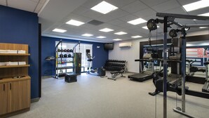 A gym with various exercise equipment, including treadmills, weight machines, and free weights. - Hampton Inn and Suites New Hartford/Utica (New Hartford)