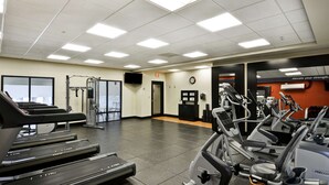 A gym with treadmills, elliptical machines, and weight machines. - Hampton Inn and Suites New Hartford/Utica (New Hartford)