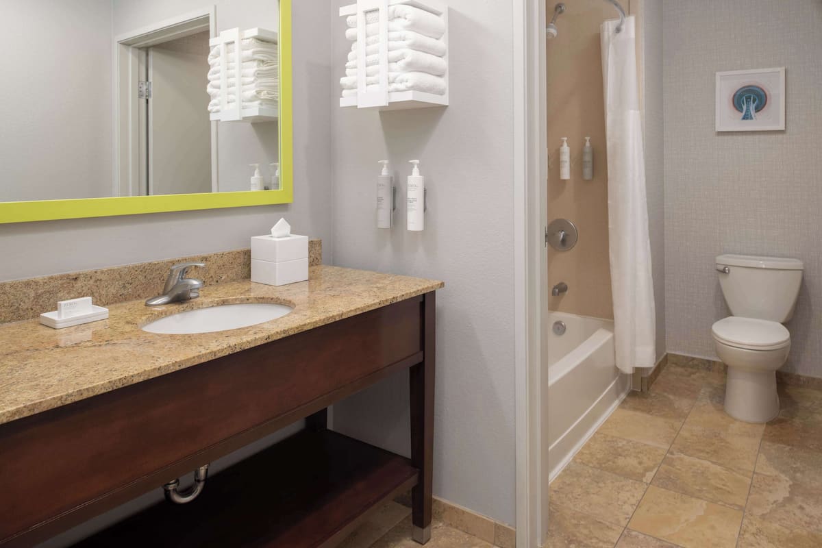 studio, two queen beds, non-smoking | bathroom | hydromassage showerhead, free toiletries, hair dryer, towels