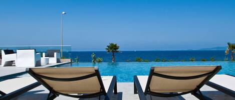 Outdoor pool, pool umbrellas, pool loungers