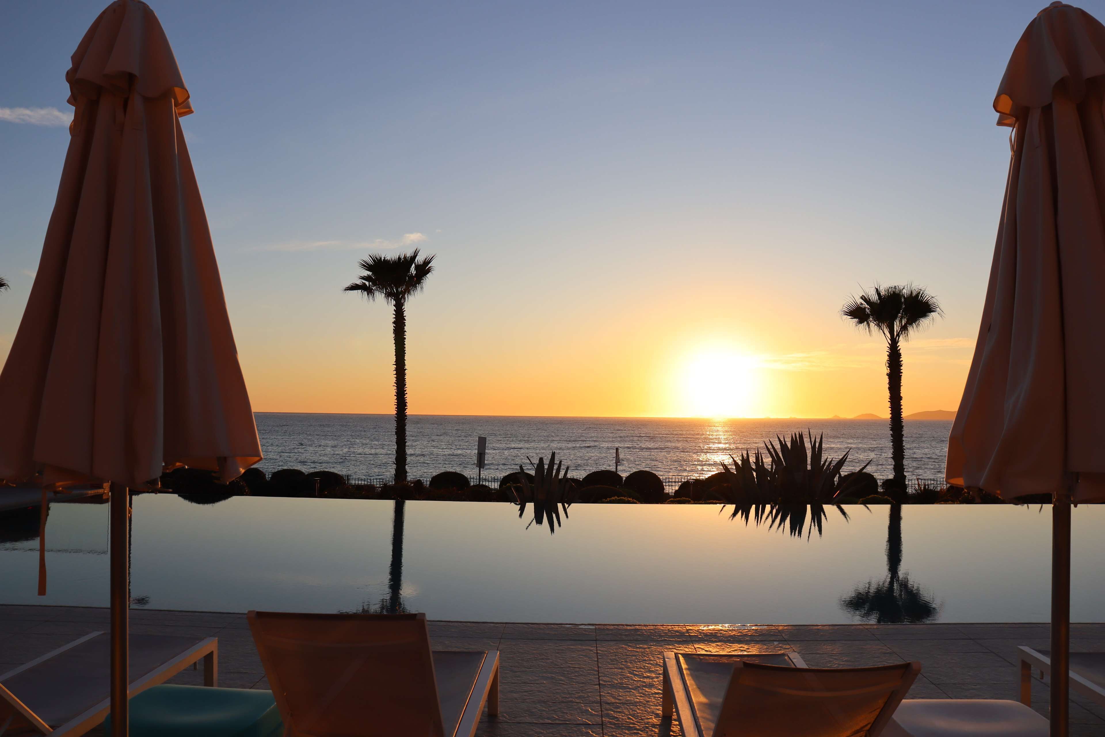 outdoor pool, pool umbrellas, pool loungers