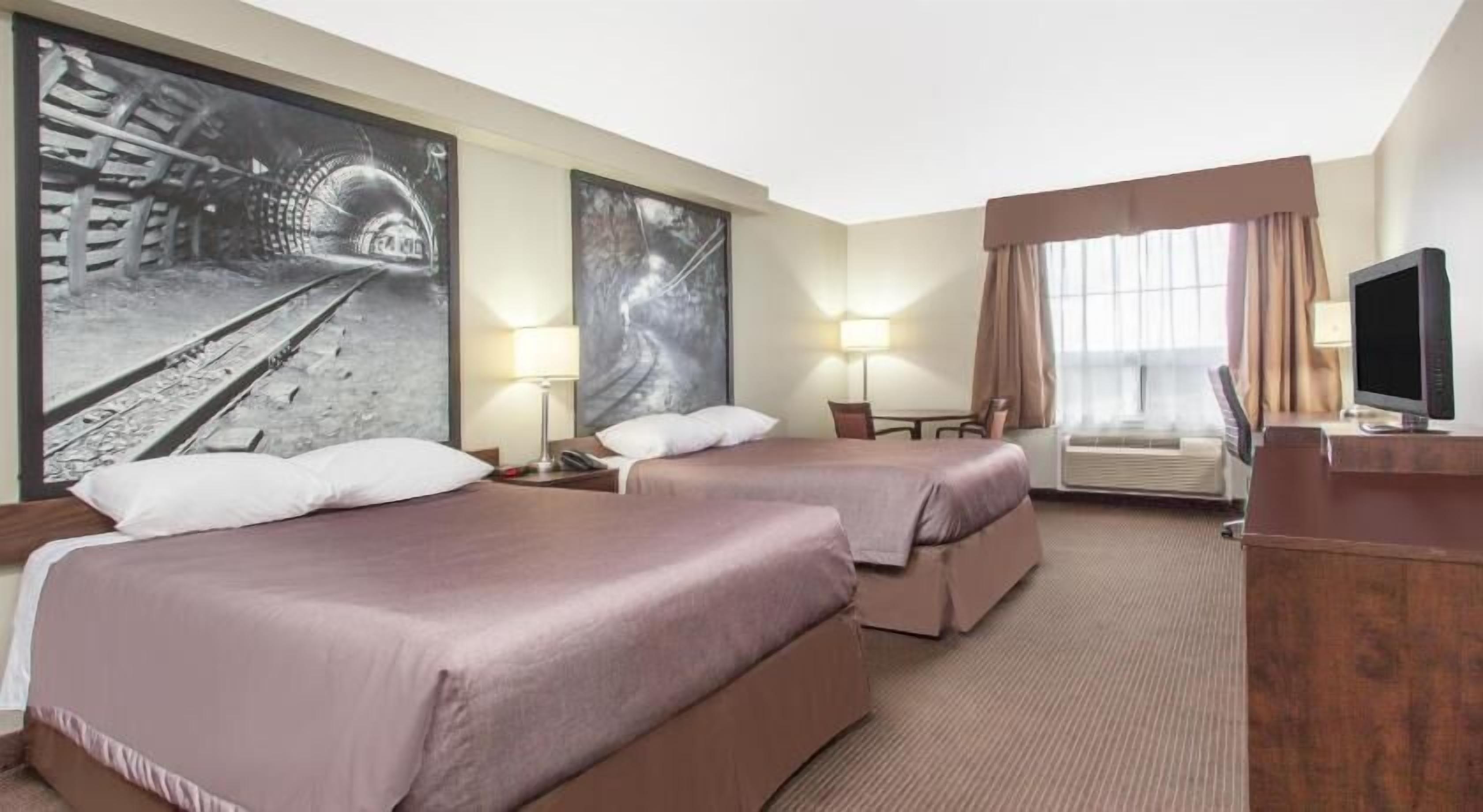 Premium bedding, desk, laptop workspace, iron/ironing board