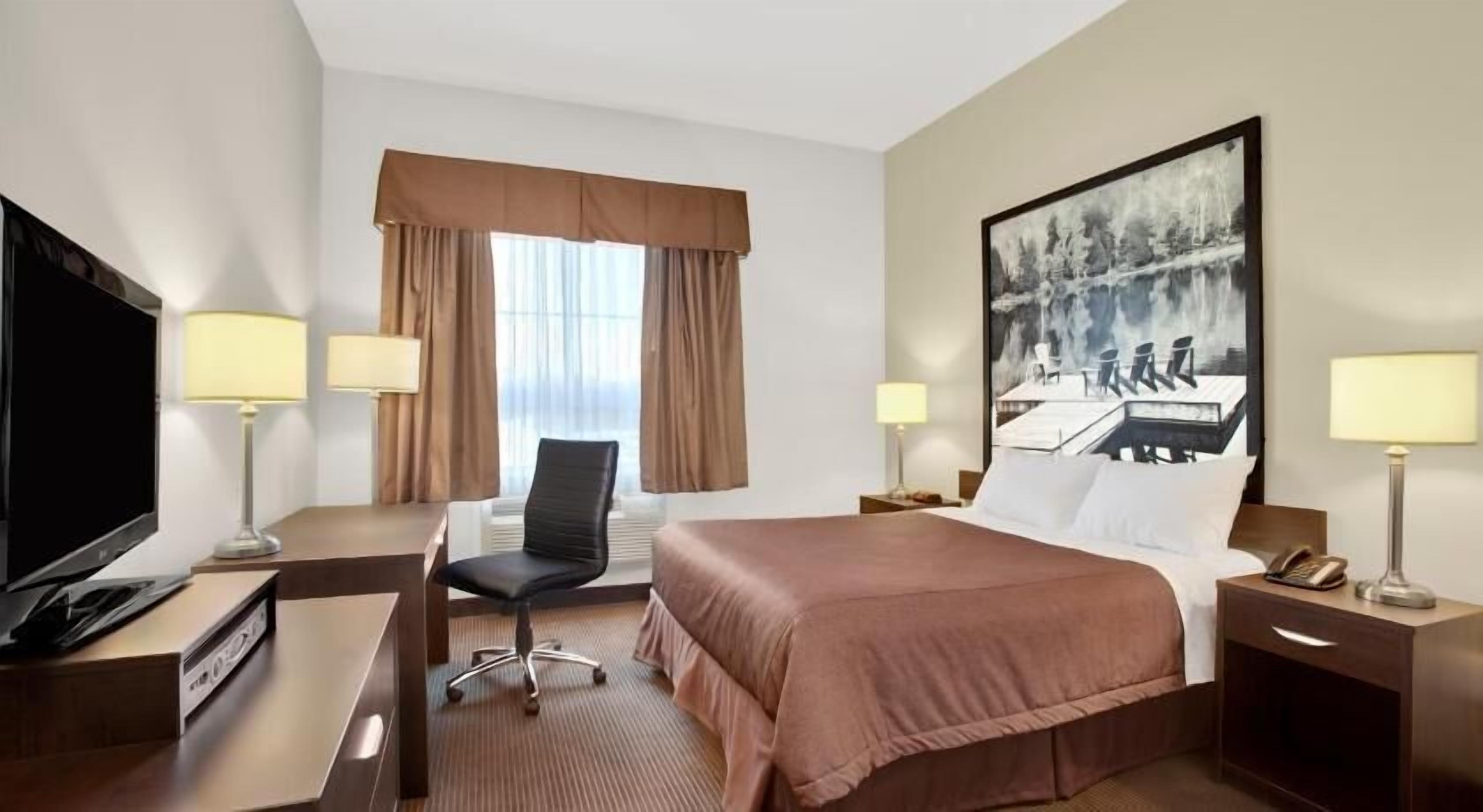 Premium bedding, desk, laptop workspace, iron/ironing board