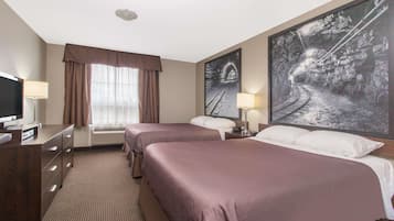 Premium bedding, desk, laptop workspace, iron/ironing board