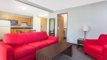 Premium bedding, desk, laptop workspace, iron/ironing board