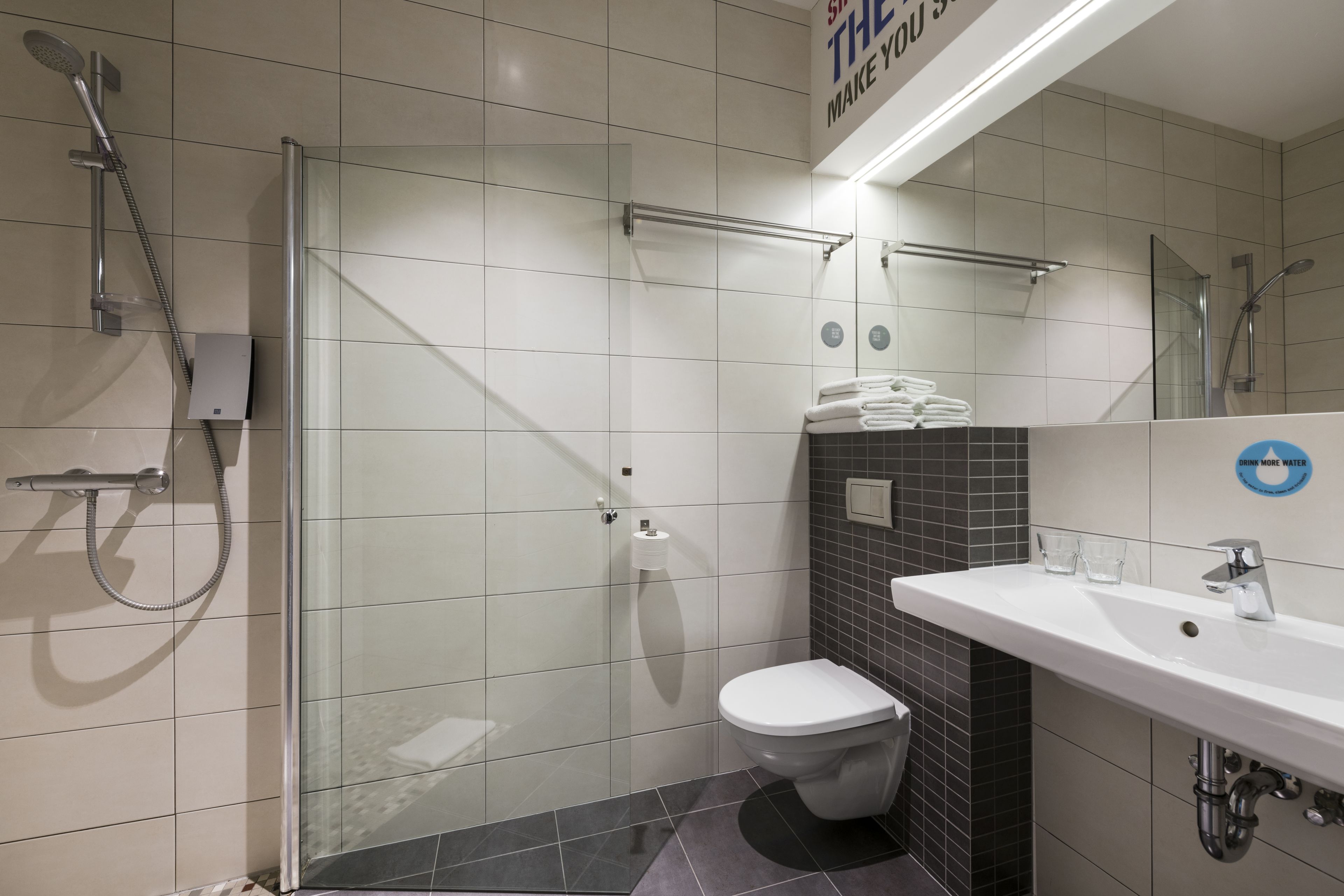 superior double room | bathroom | shower, hair dryer, towels
