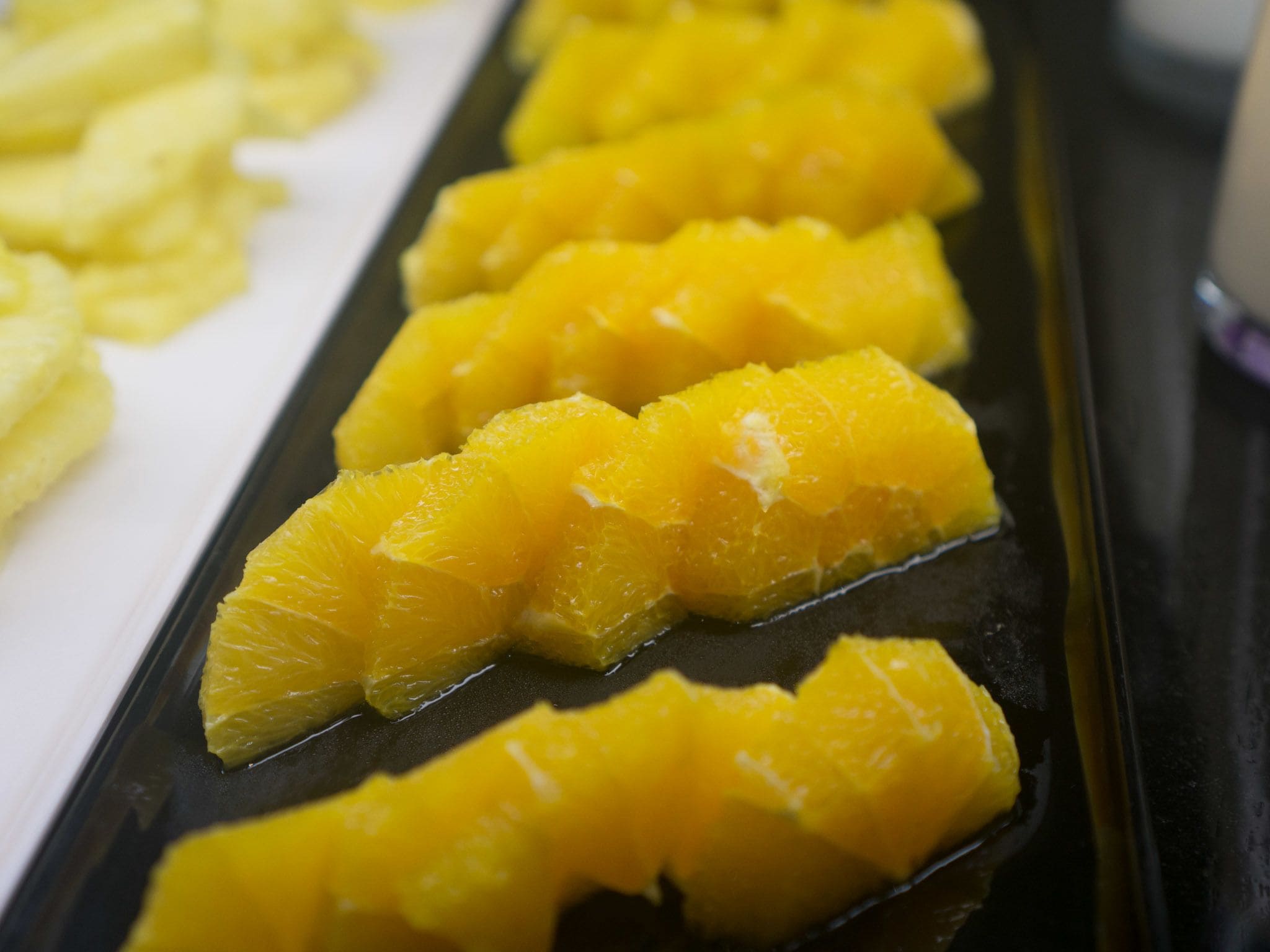 A tray of sliced oranges.