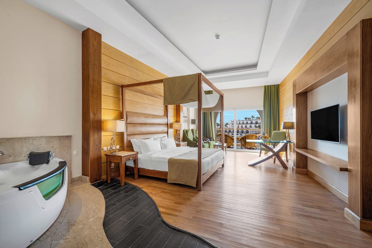 Suite, 1 King Bed, Pool View (Royal Savoy Junior King Bed Suite (Ad) | Egyptian cotton sheets, hypo-allergenic bedding, minibar, in-room safe