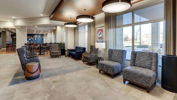A spacious lobby with modern furniture, large windows, and a ceiling with recessed lighting. - Drury Plaza Hotel Denver Westminster (Westminster)