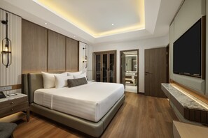 Suite ejecutiva | Ropa de cama de alta calidad y minibar