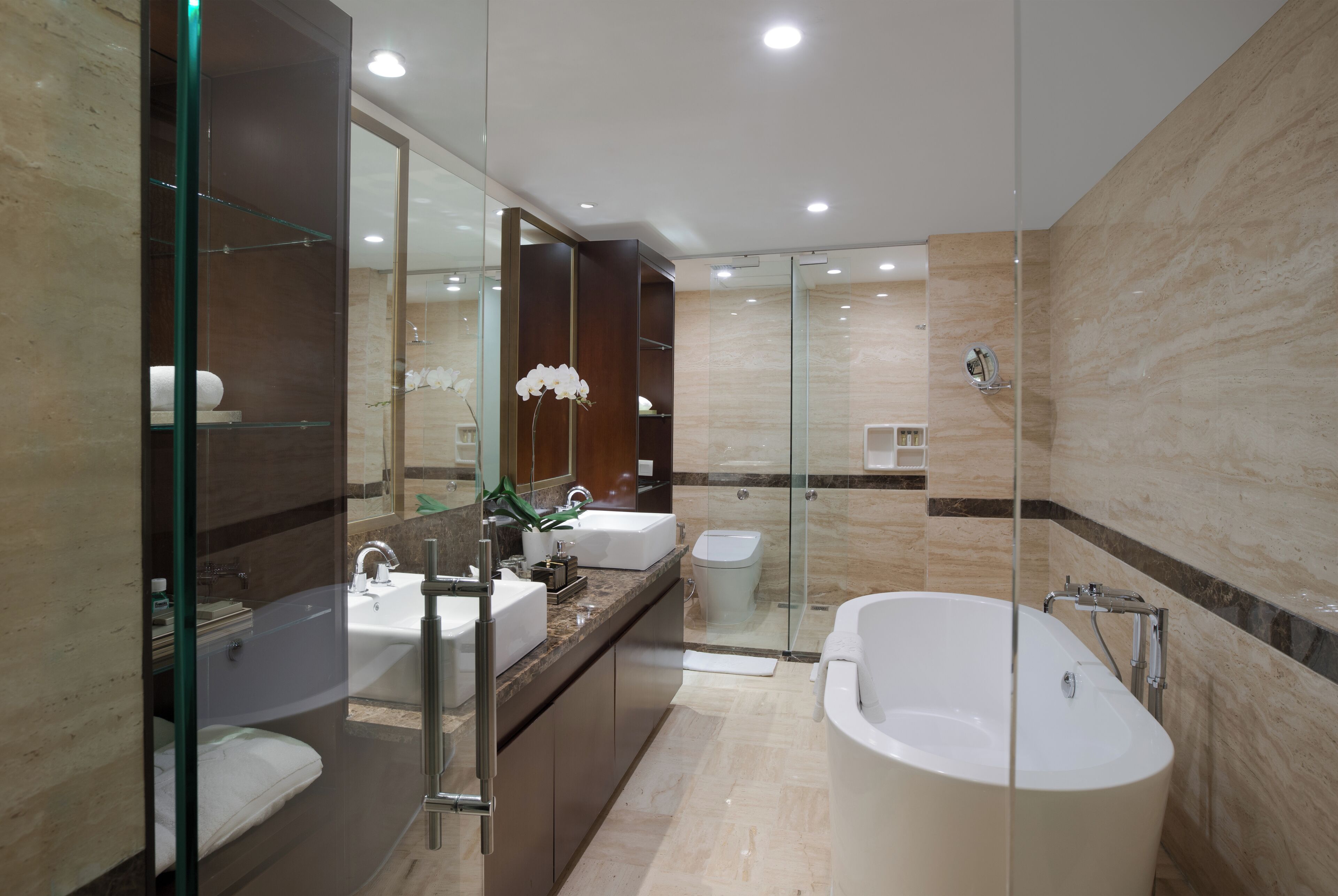 ambarrukmo suite | bathroom | rainfall showerhead, free toiletries, hair dryer, slippers