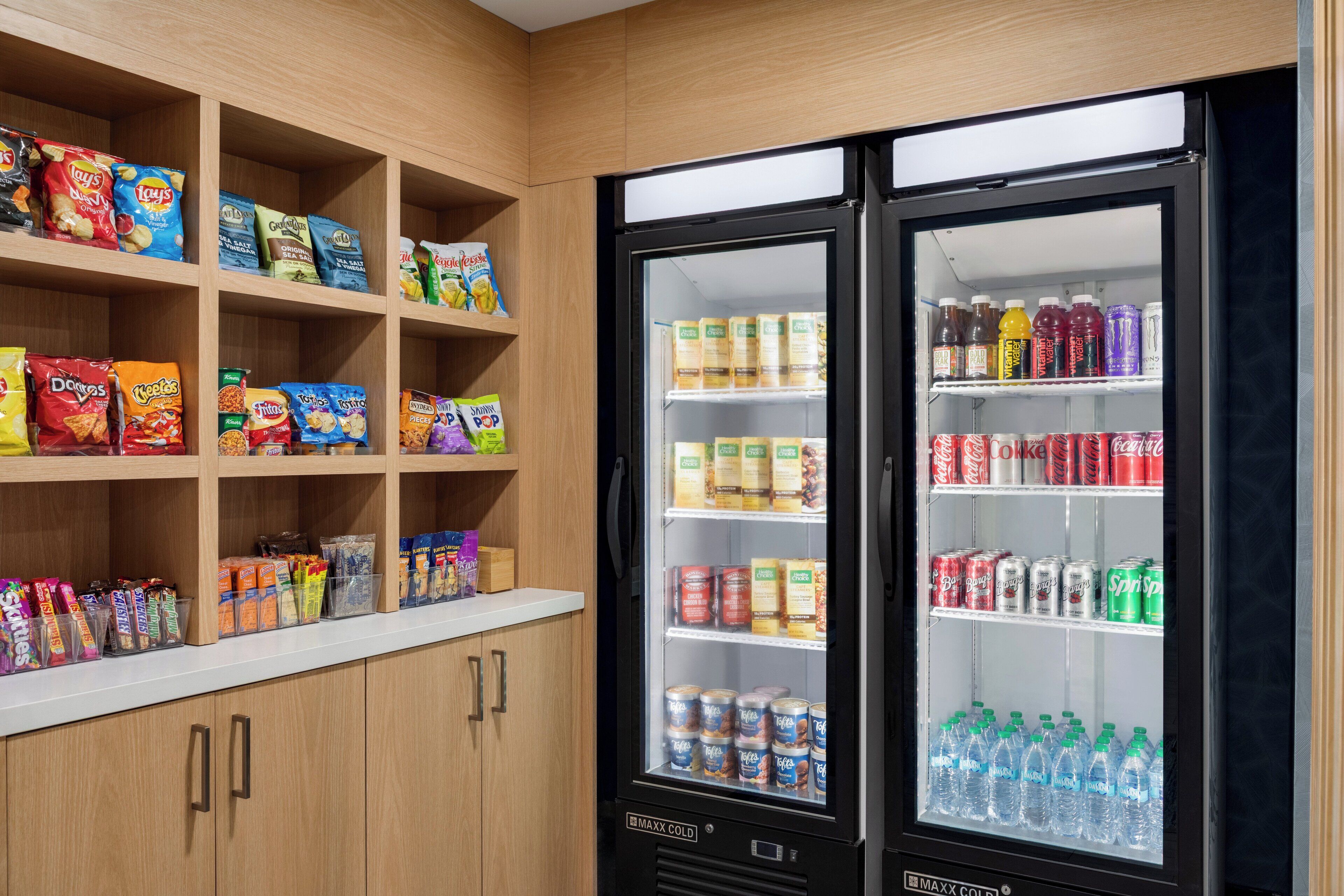 A snack and beverage vending area with various snacks and drinks.