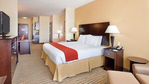 A hotel room with a large bed, bedside tables, a TV, a desk, and a chair. - Holiday Inn Express Hotel & Suites Gallup East by IHG (Gallup)