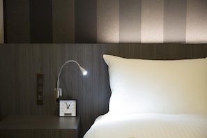 Down duvets, desk, laptop workspace, blackout curtains
