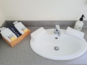 Shower, free toiletries, hair dryer, towels