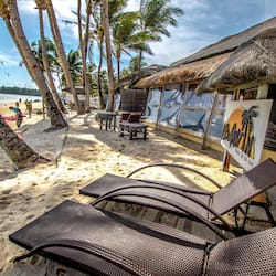 On the beach, white sand, free beach cabanas, sun-loungers