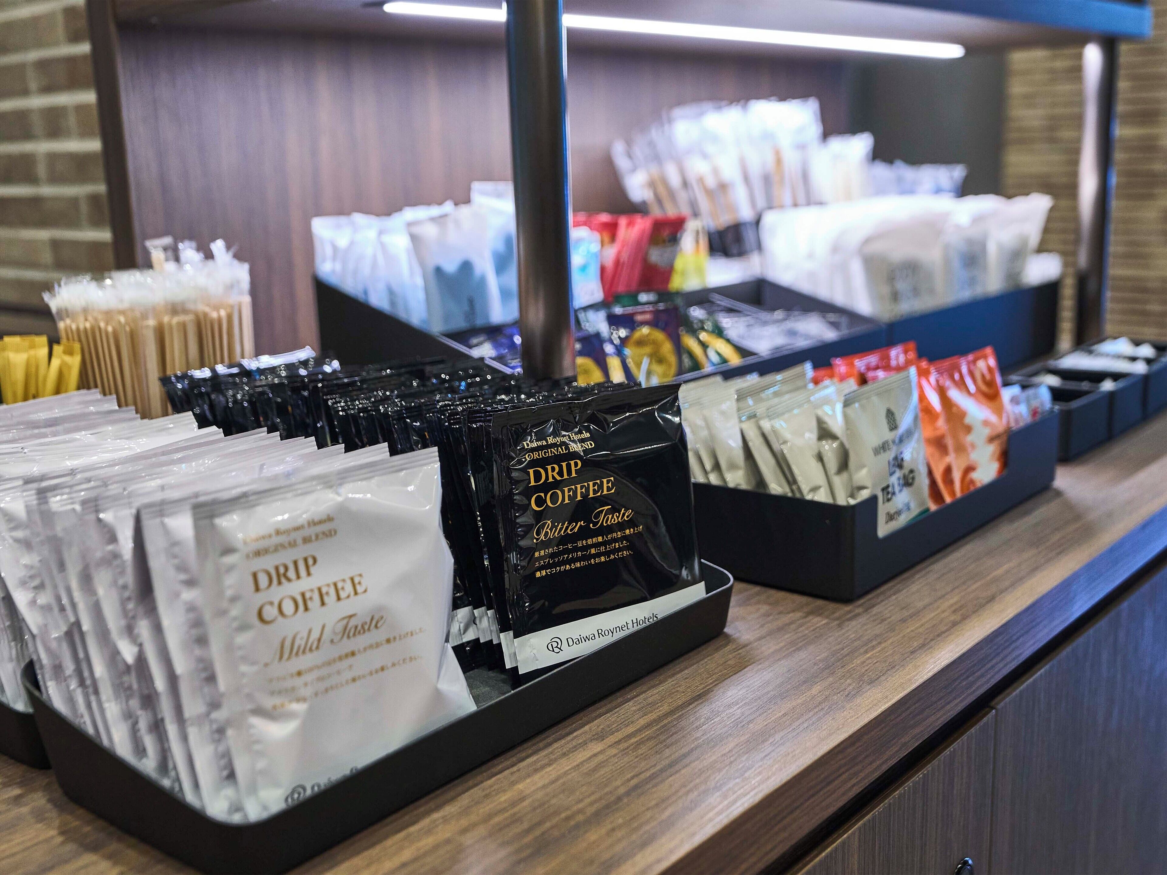 A coffee display with various bags of coffee and tea.