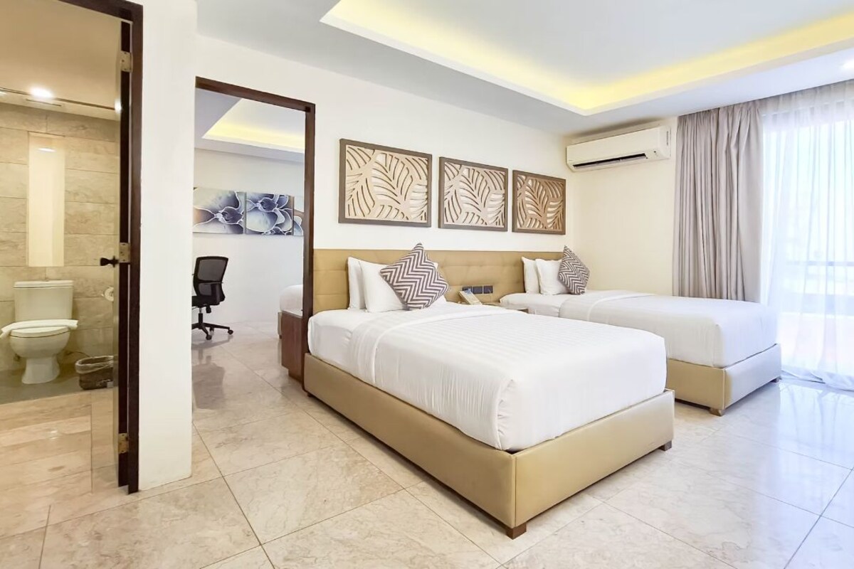 Family Room | Hypo-allergenic bedding available, minibar, in-room safe, desk
