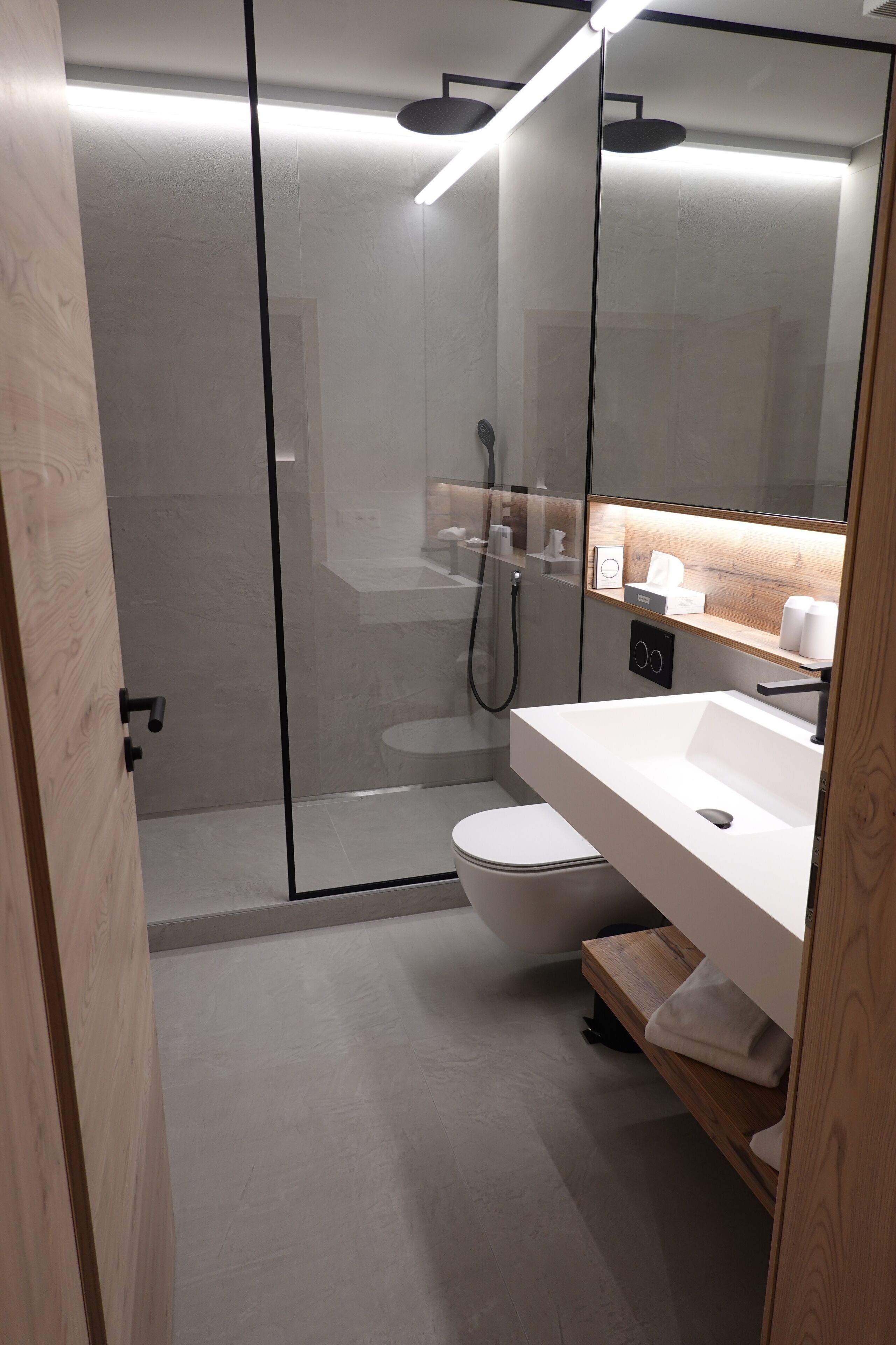 shower, rainfall showerhead, hair dryer, towels