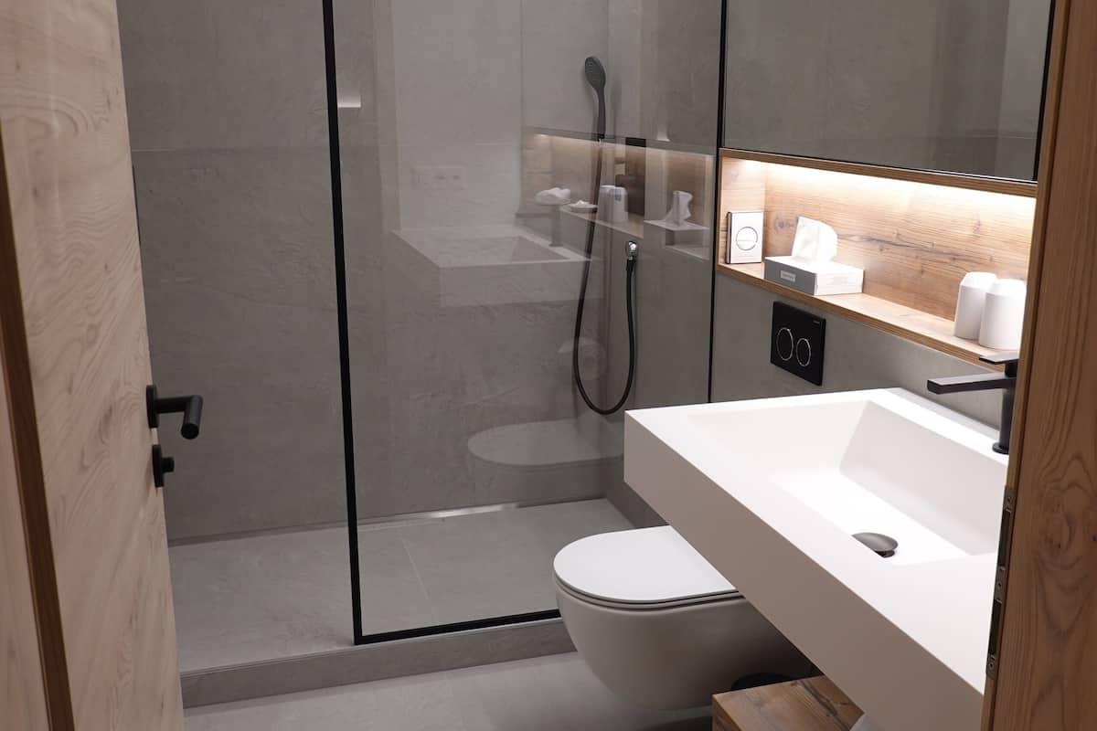 shower, rainfall showerhead, hair dryer, towels