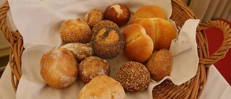 A basket of assorted bread rolls.