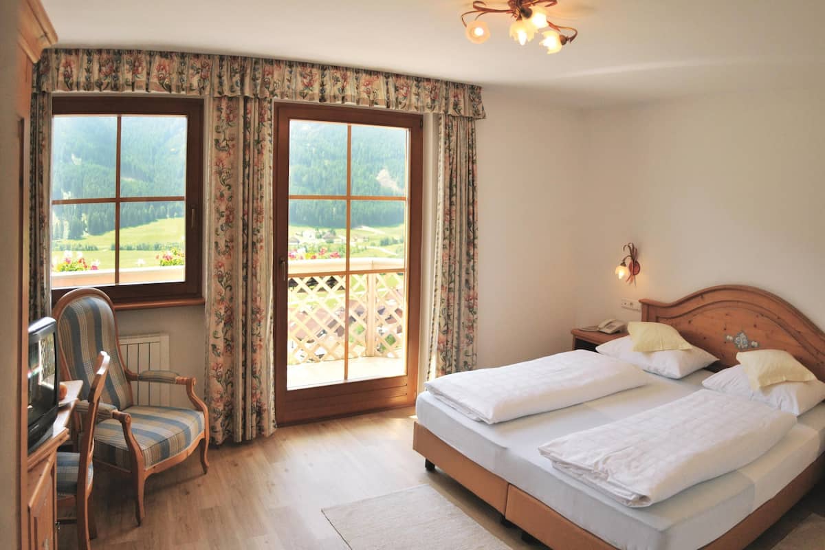 economy double room | premium bedding, select comfort beds, in-room safe, desk