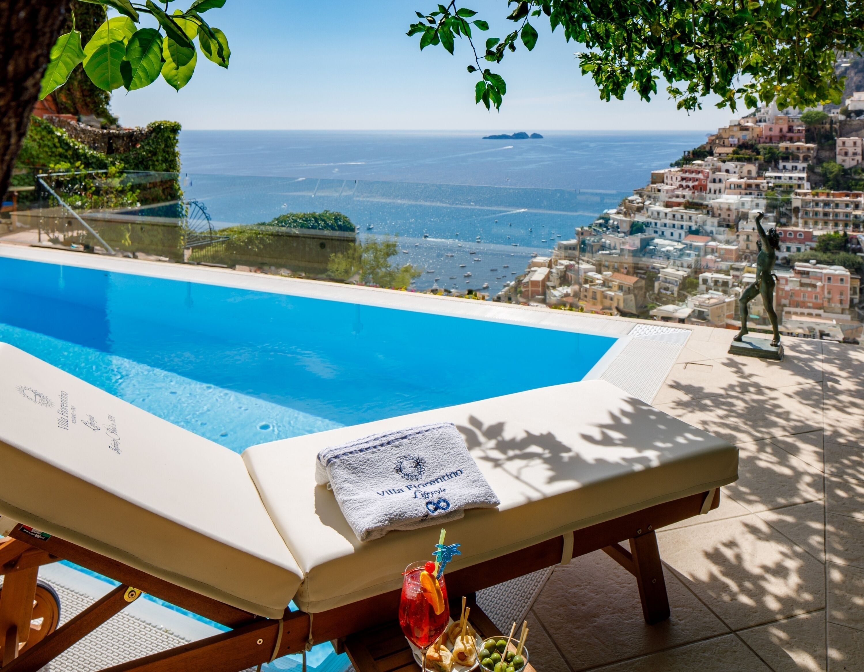 Seasonal outdoor pool, open 9:00 AM to 8:00 PM, pool umbrellas