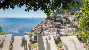 A seaside view from a villa with lounge chairs labeled "Villa Fiorentino" and "Infinity Pool & SPA". - VILLA FIORENTINO POSITANO  (Positano)