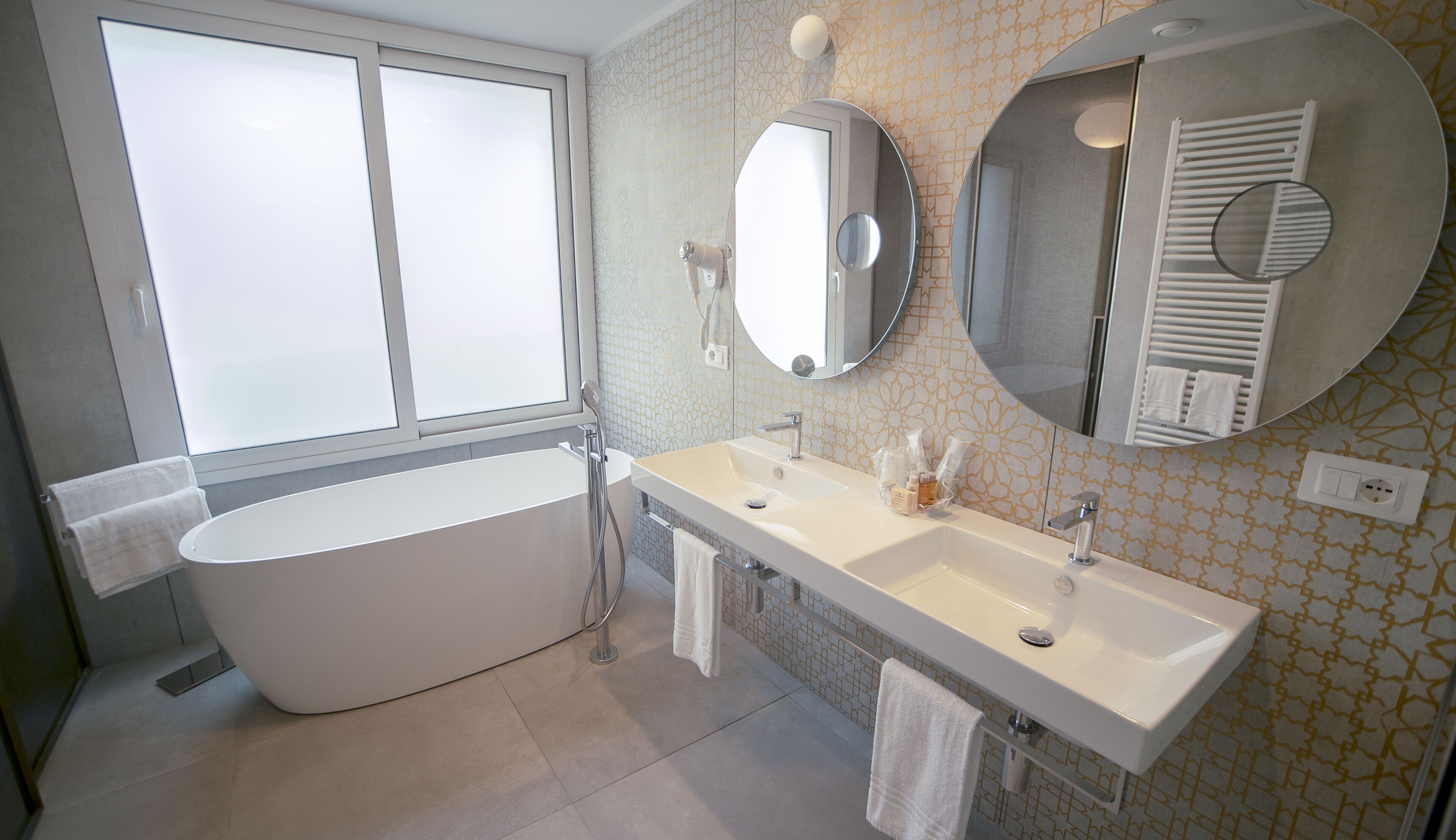 deluxe triple room | bathroom | shower, free toiletries, hair dryer, bathrobes