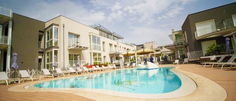 Seasonal outdoor pool, pool umbrellas, pool loungers