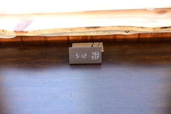 A digital thermometer displaying 9:12, 46% RH, and 55°F.