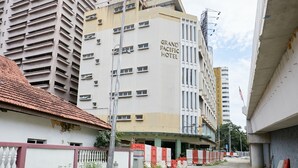 A multi-story building with the sign "Grand Pacific Hotel" on its facade. - Grand Pacific Hotel PWTC (Kuala Lumpur)